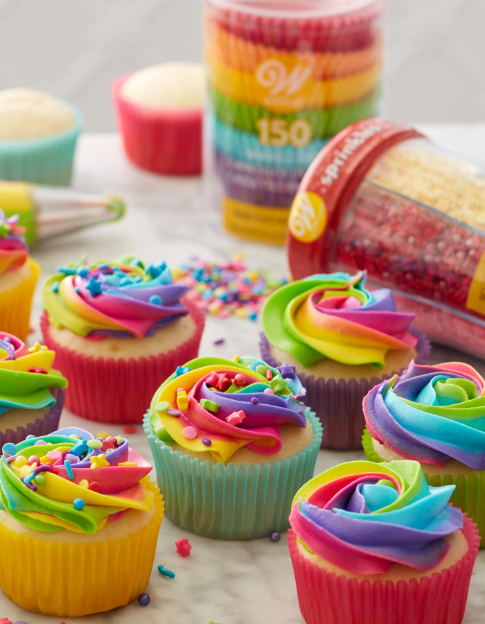 cupcakes with rainbow icing and sprinkles